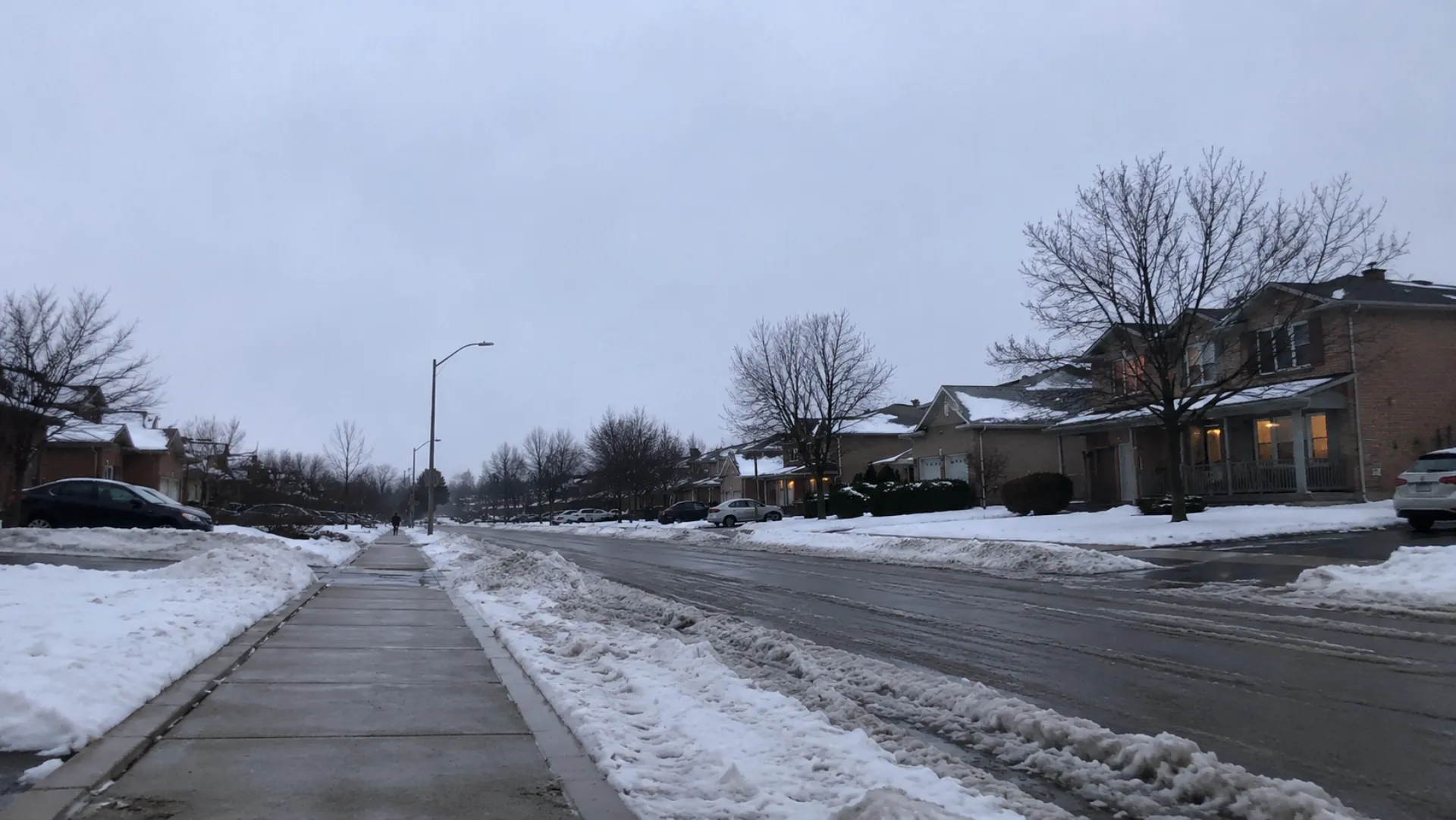 Freshly plowed residential street after a snowfall