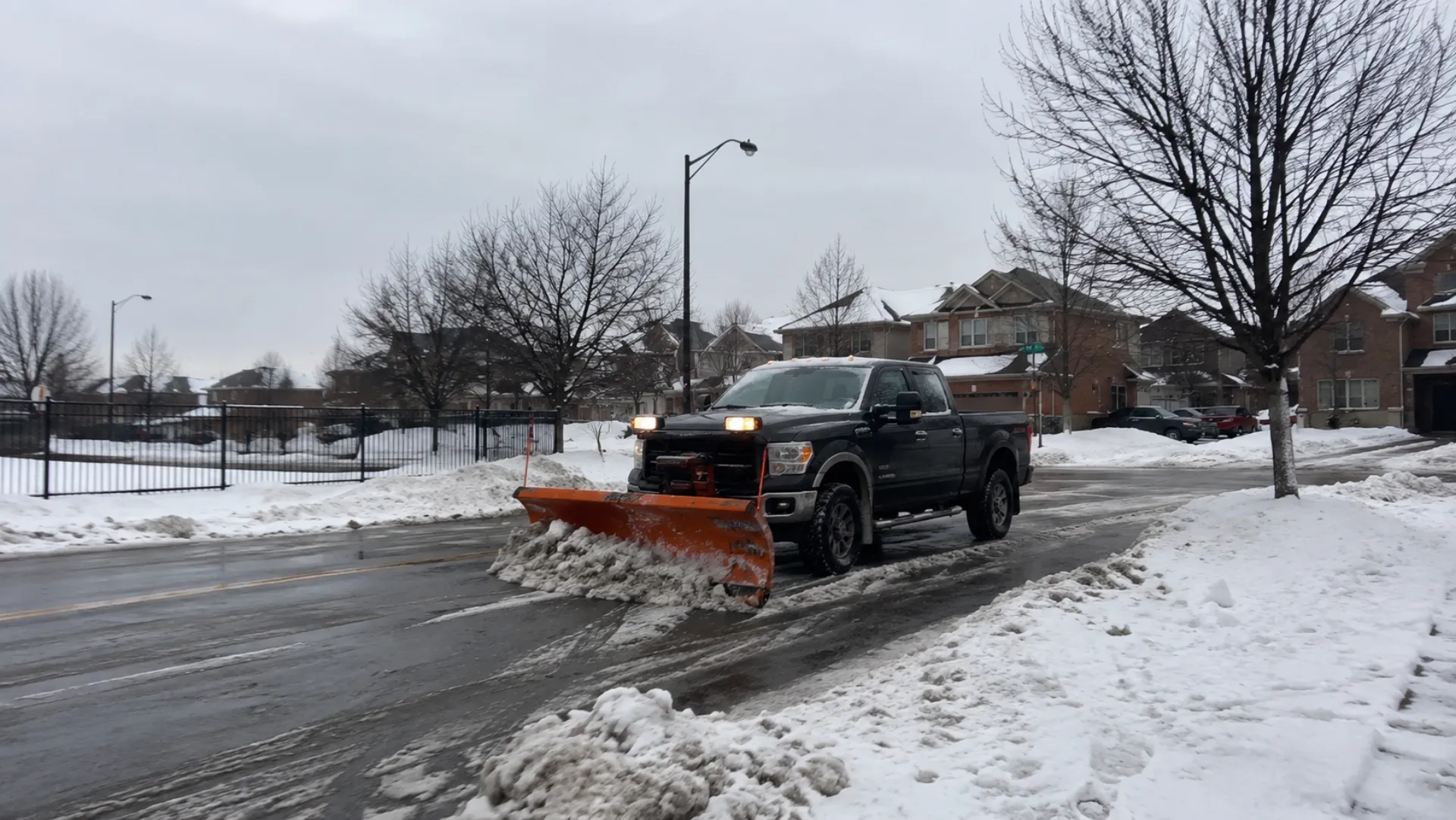 Plow truck clearing a residential GTA street
